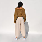 Back photo of a model wearing the chef pants in white flour by Meals.