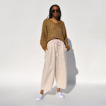 Photo of a model wearing the chef pants in white flour by Meals.