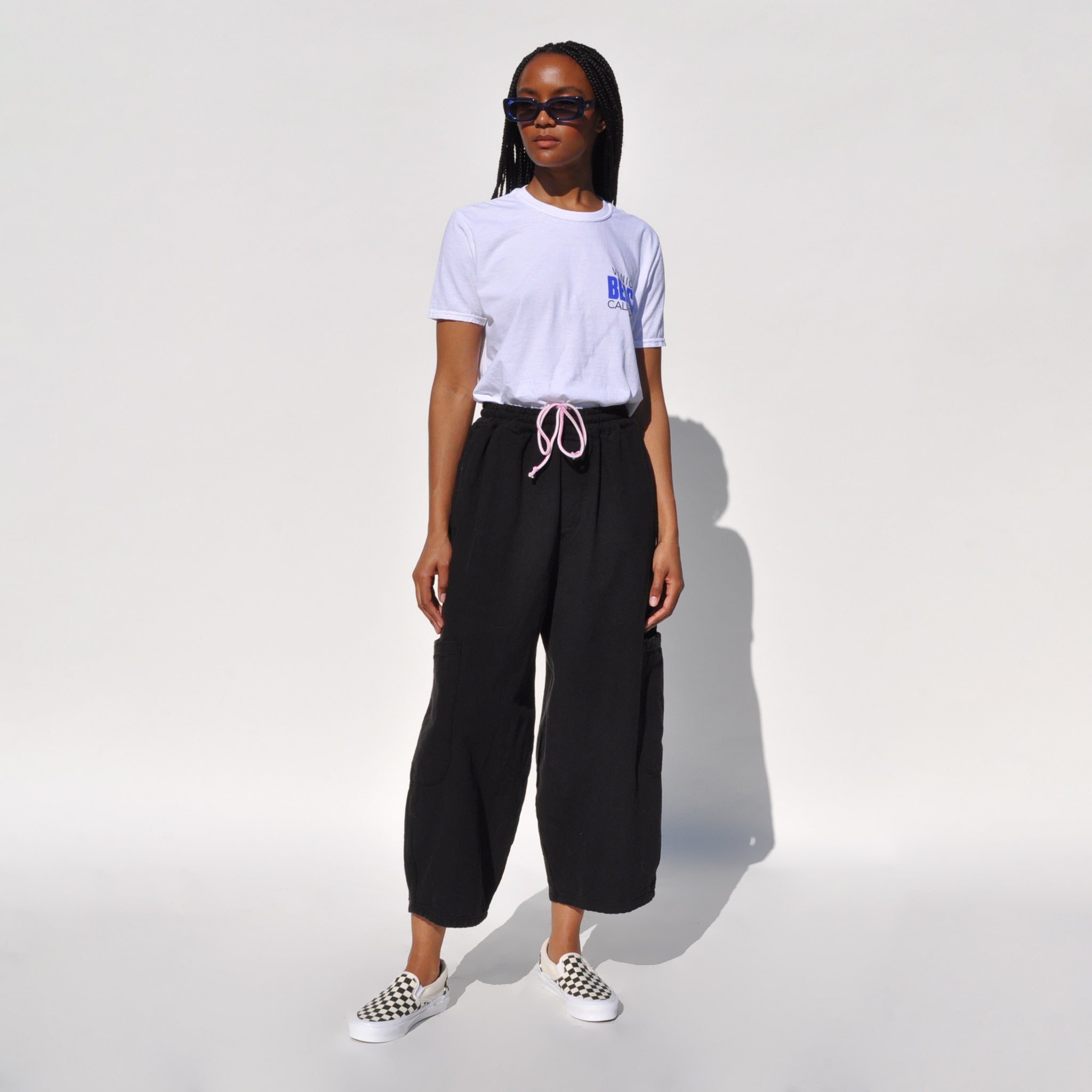 Photo of a model wearing the chef pants in lack licorice by Meals.