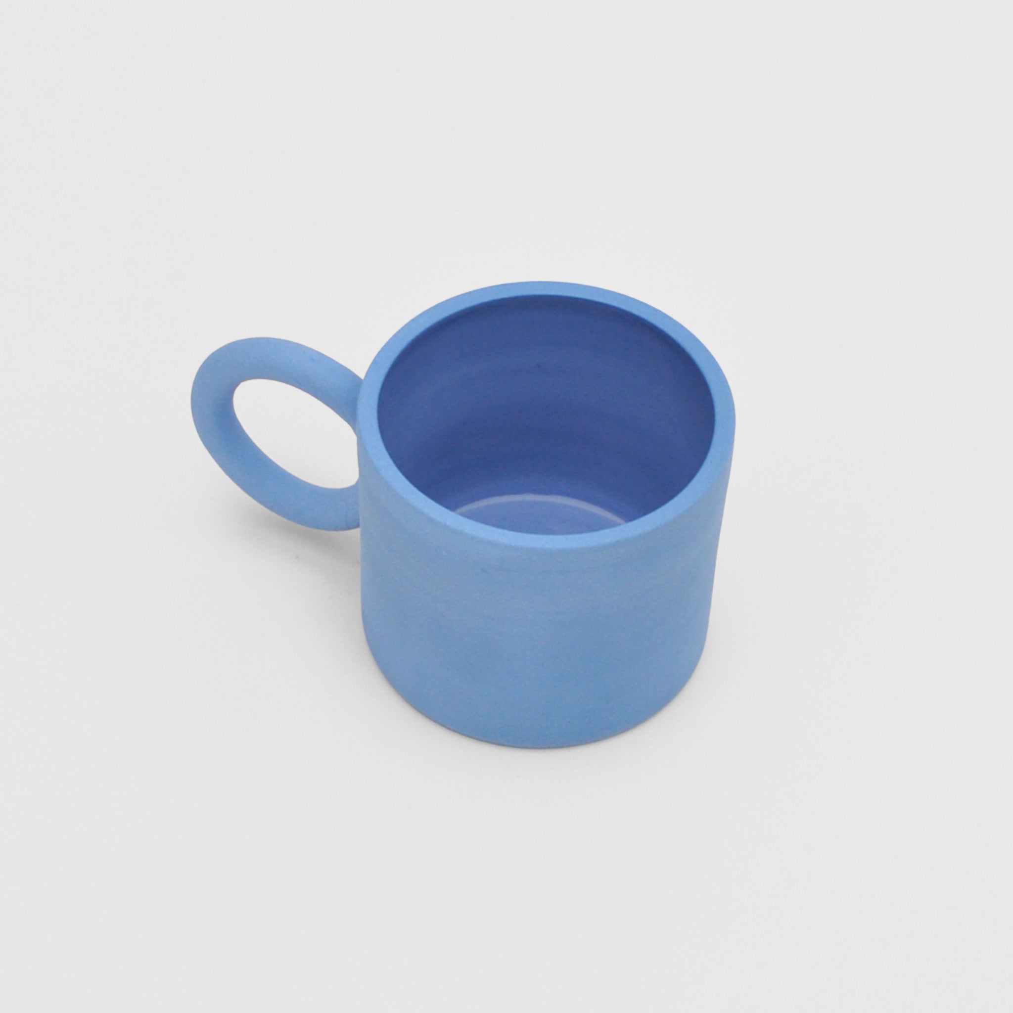 Above image of the circle mug in blue by Ekua Ceramics.