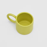 Above angle image of Ekua Ceramics circle mug in acid, our LCD exclusive color.