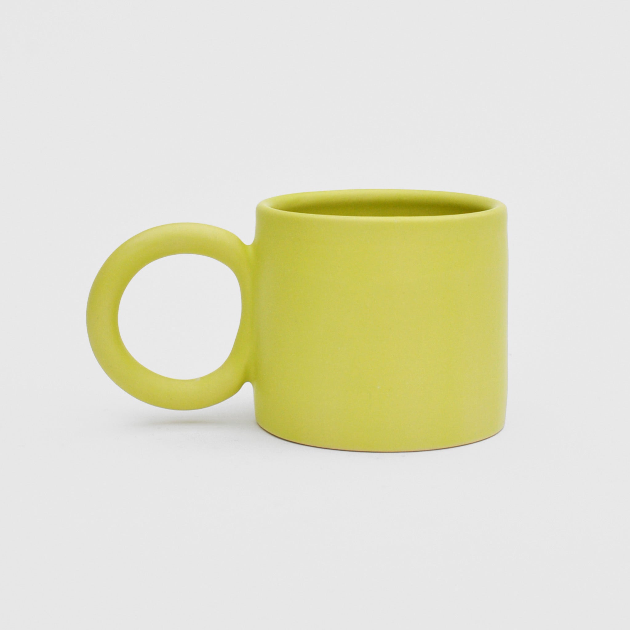 Front image of Ekua Ceramics circle mug in acid, our LCD exclusive color.