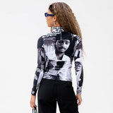 Back half body photo of model wearing the Colette High Neck Top - Romantic B&W.