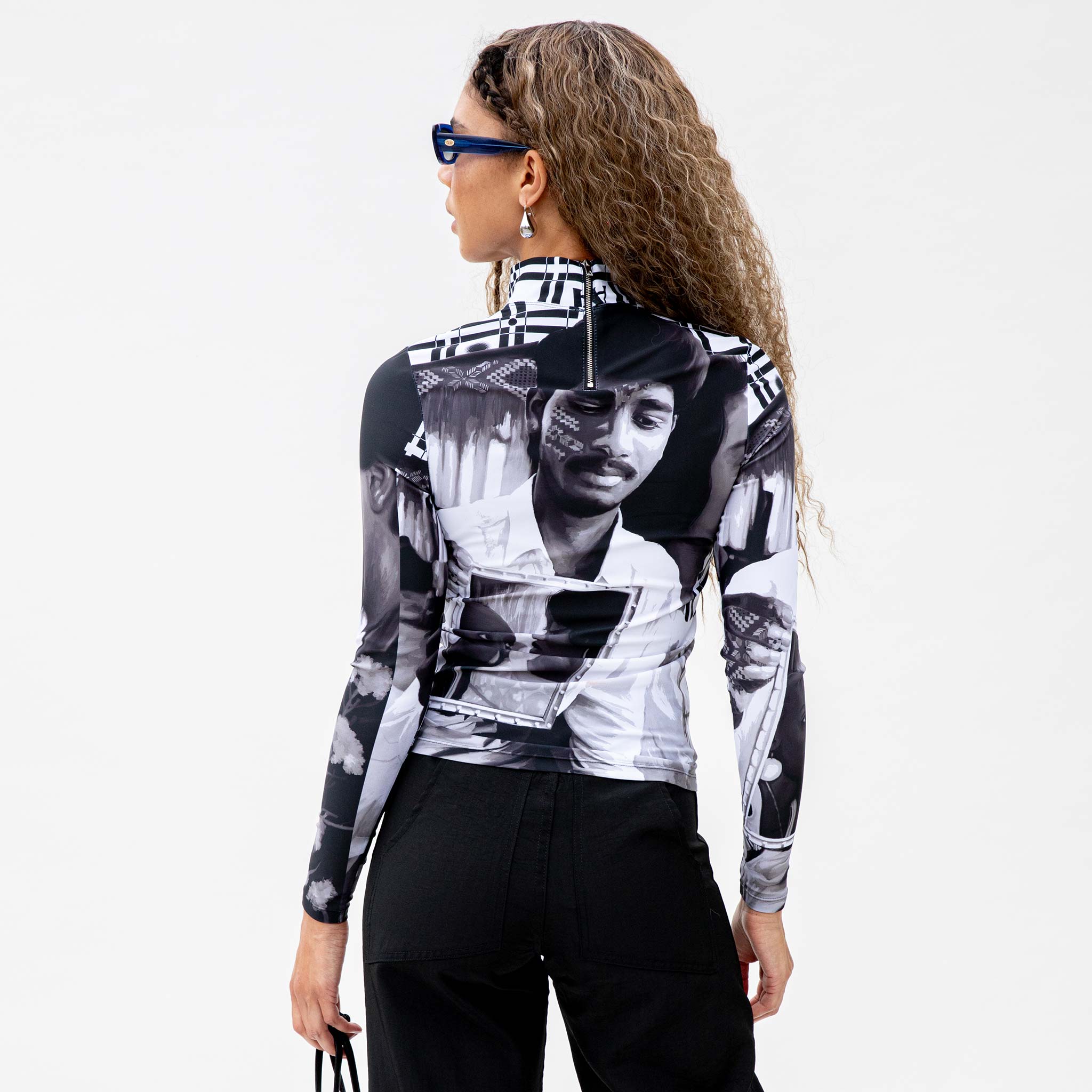Back half body photo of model wearing the Colette High Neck Top - Romantic B&W.