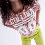 Close detail photo of model wearing the Collina Tee - Hi-Liter Floral.