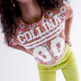 Close detail photo of model wearing the Collina Tee - Hi-Liter Floral.
