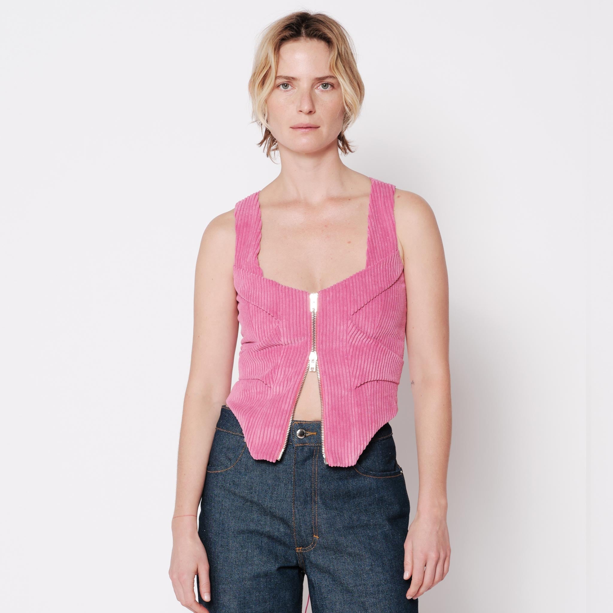 Front half body photo of model wearing the Cord Bustier - Pitaya.