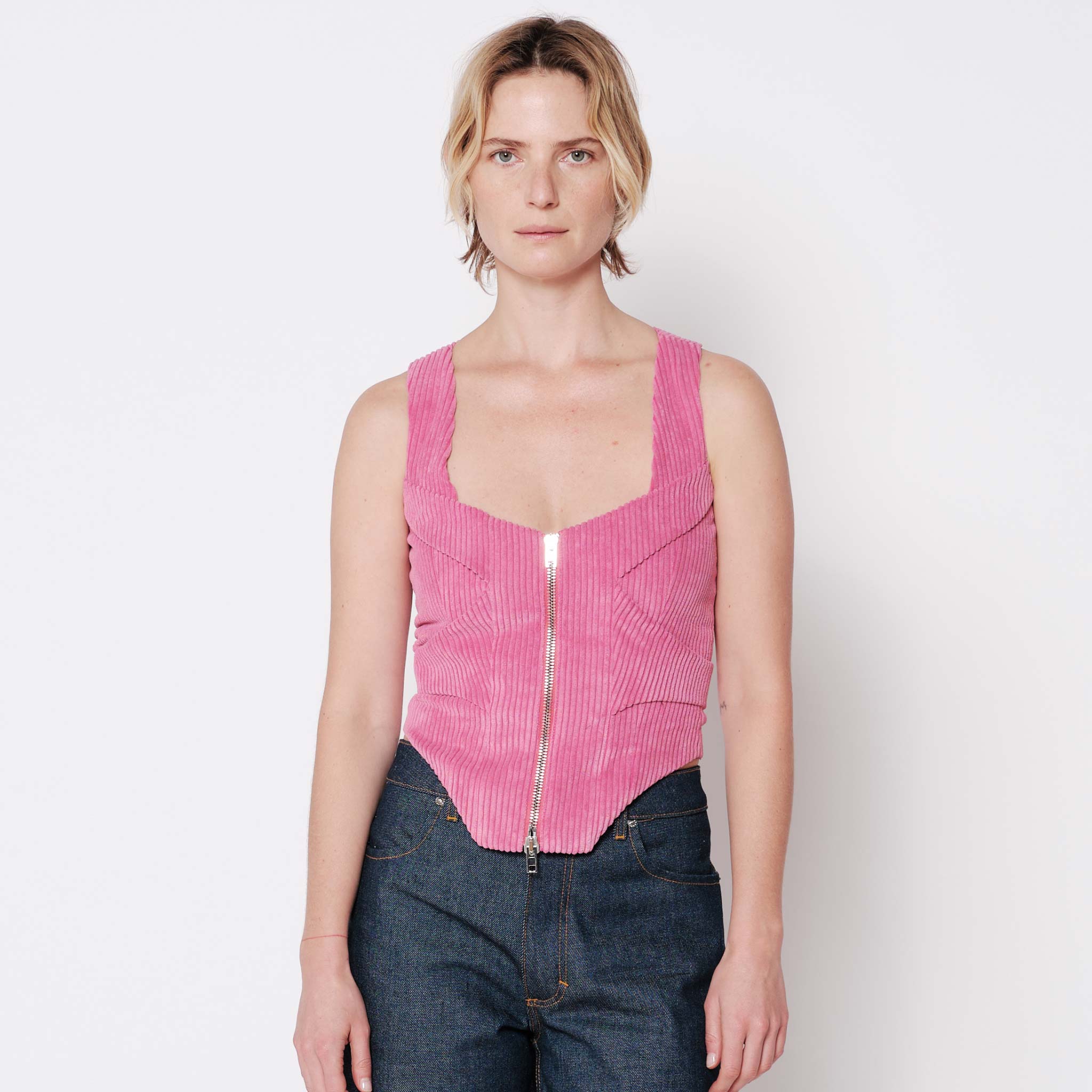 Front half body photo of model wearing the Cord Bustier - Pitaya.