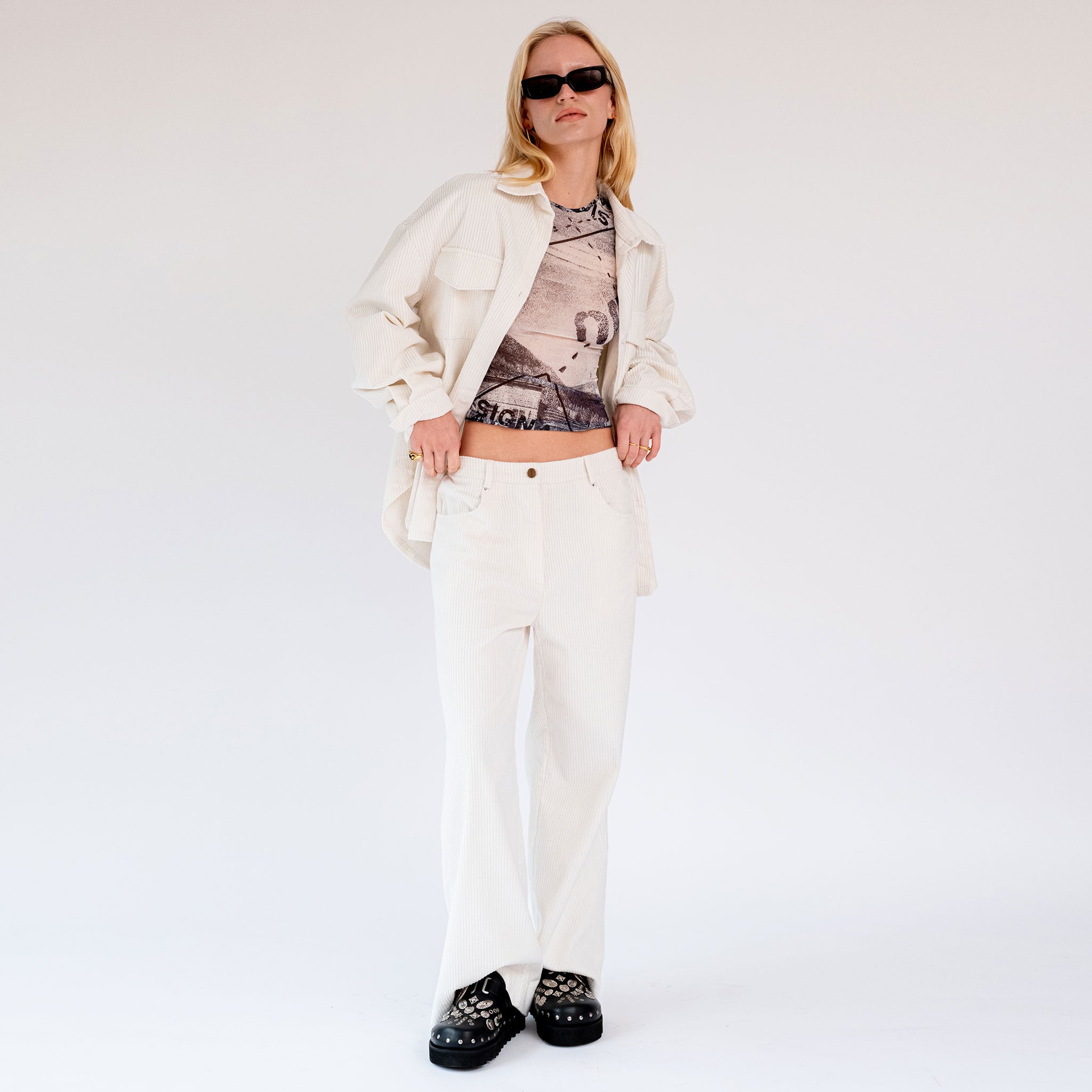 Full body photo of model wearing the Corduroy Wide Leg Pants - Powder.