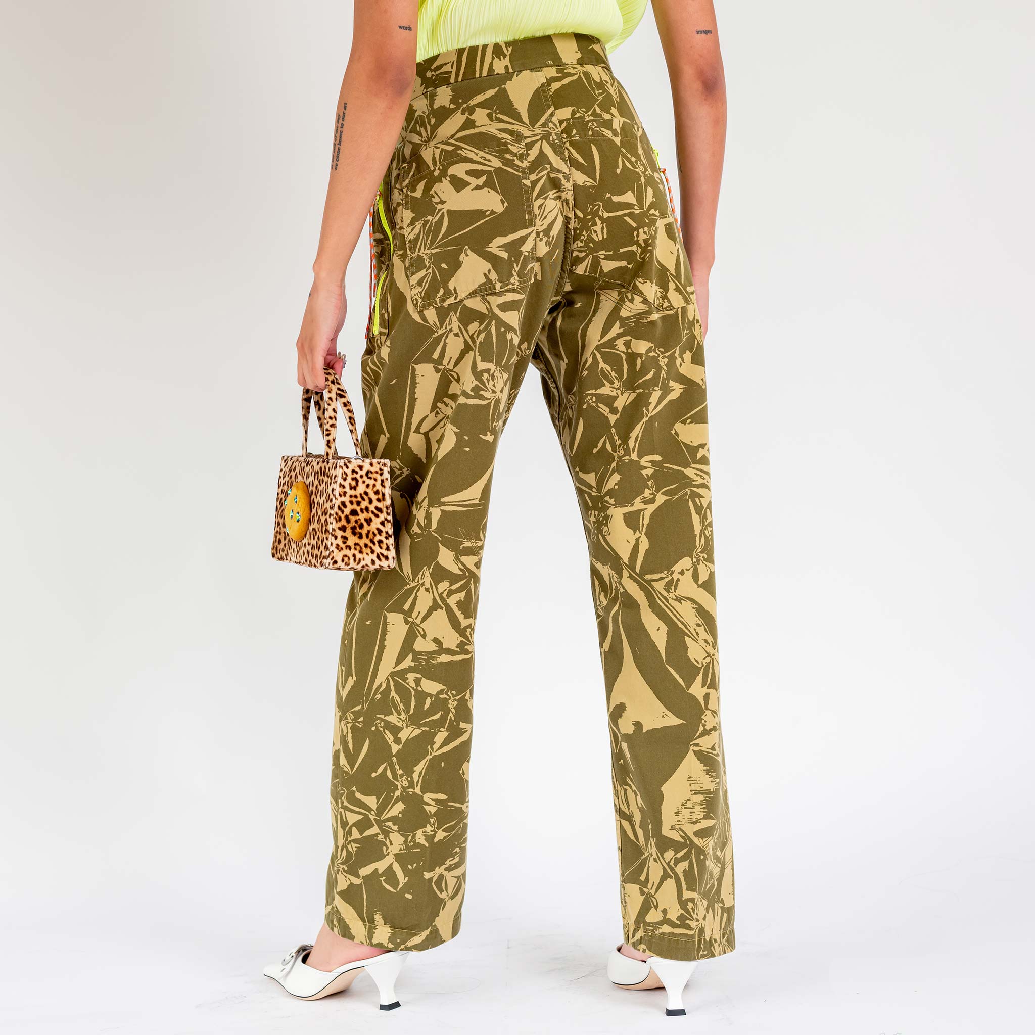 Back view of a model wearing the unisex Aries Crinkle Camo Walking Trouser.
