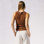Back half body photo of model wearing the Dance Crochet Vest.