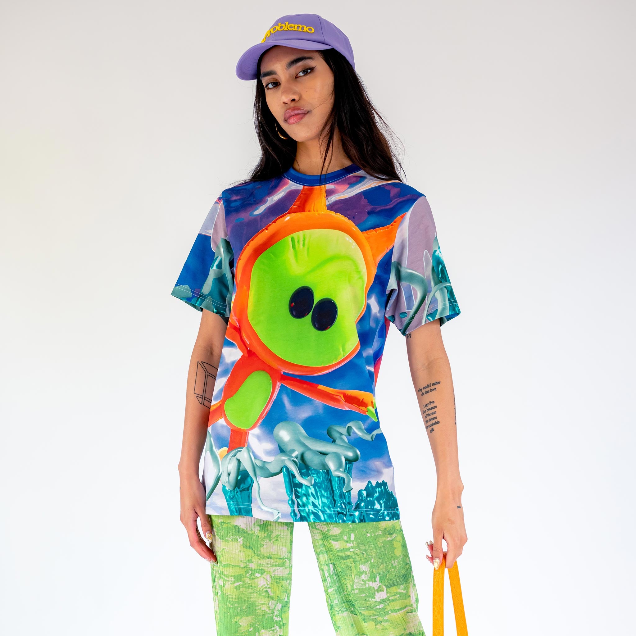 Front half body photo of model wearing the Deep Sea Marpi Tee.