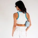 Back half body photo of model wearing the Dimmy Tank - White.