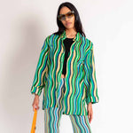 Close half body photo of model wearing the Dodo Shirt - Blue Stripe.