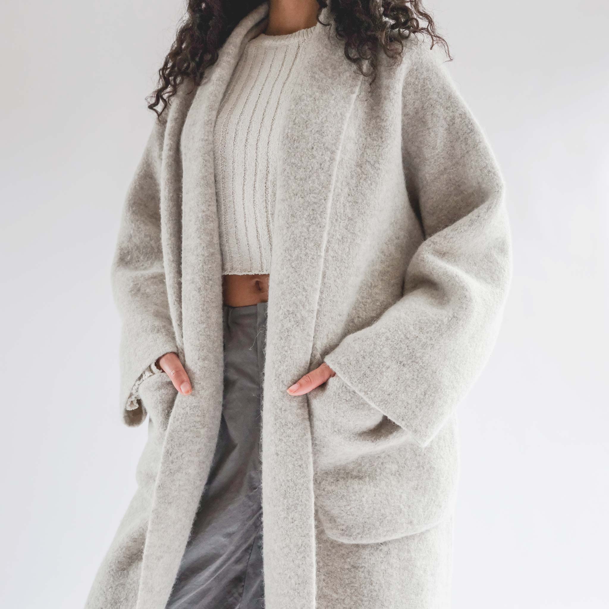 Half body photo of model wearing the Double Face Long Coat - Peeble.