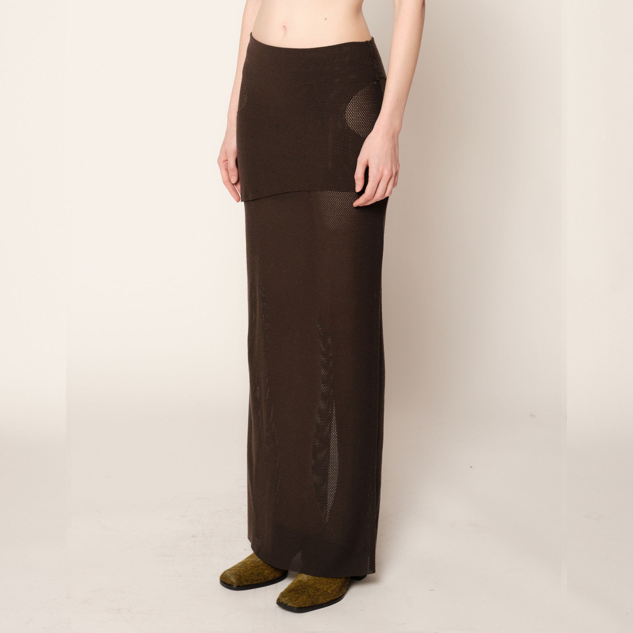 Side half body photo of model wearing the Eclipse Skirt - Stone.