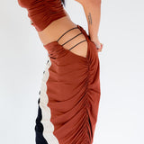 Side detail photo of model wearing the Elshadai Skirt