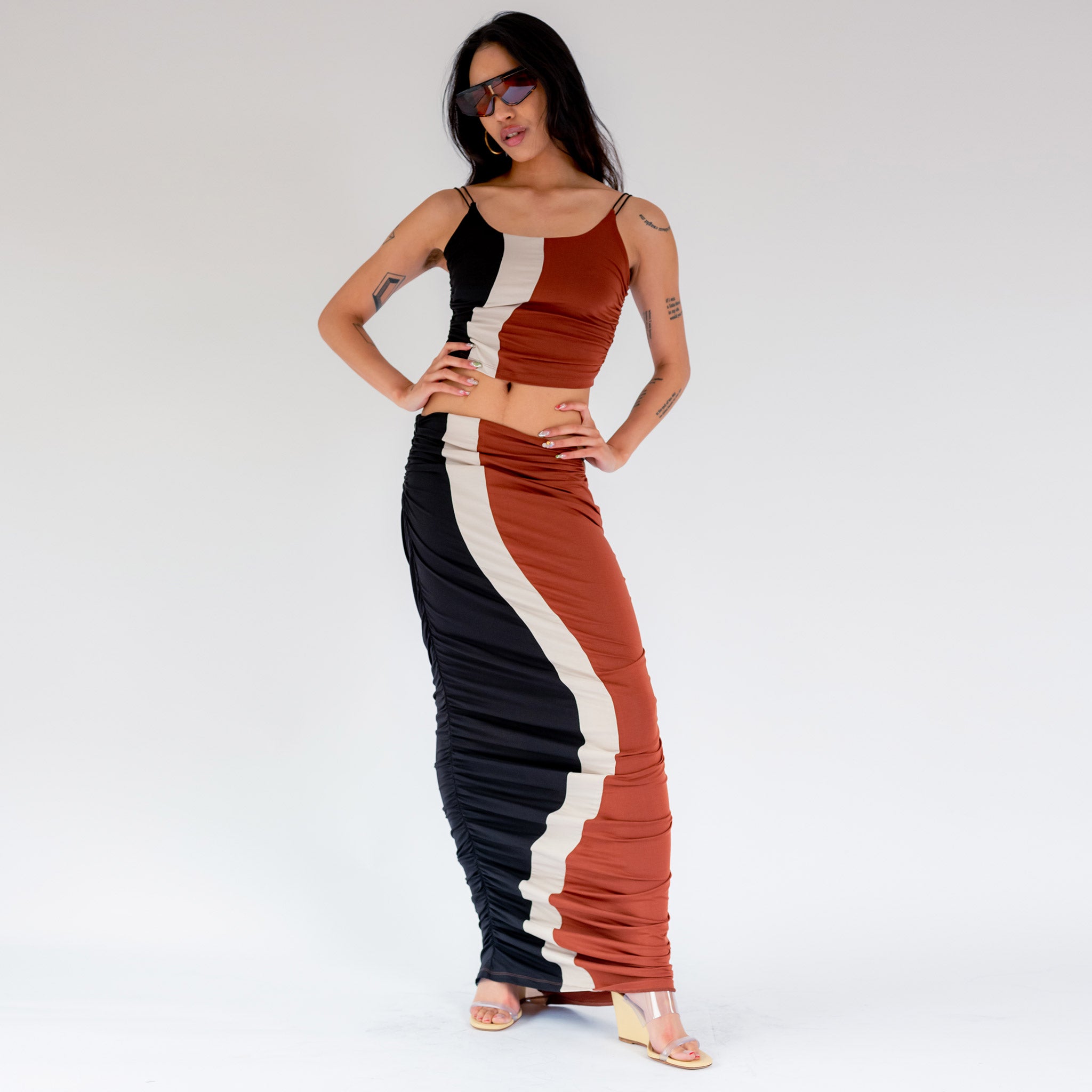 Full body photo of model wearing the Elshadai Top - Black/Rust/Beige.