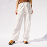Close half body photo of model wearing the Eternal Trousers - Ivory.