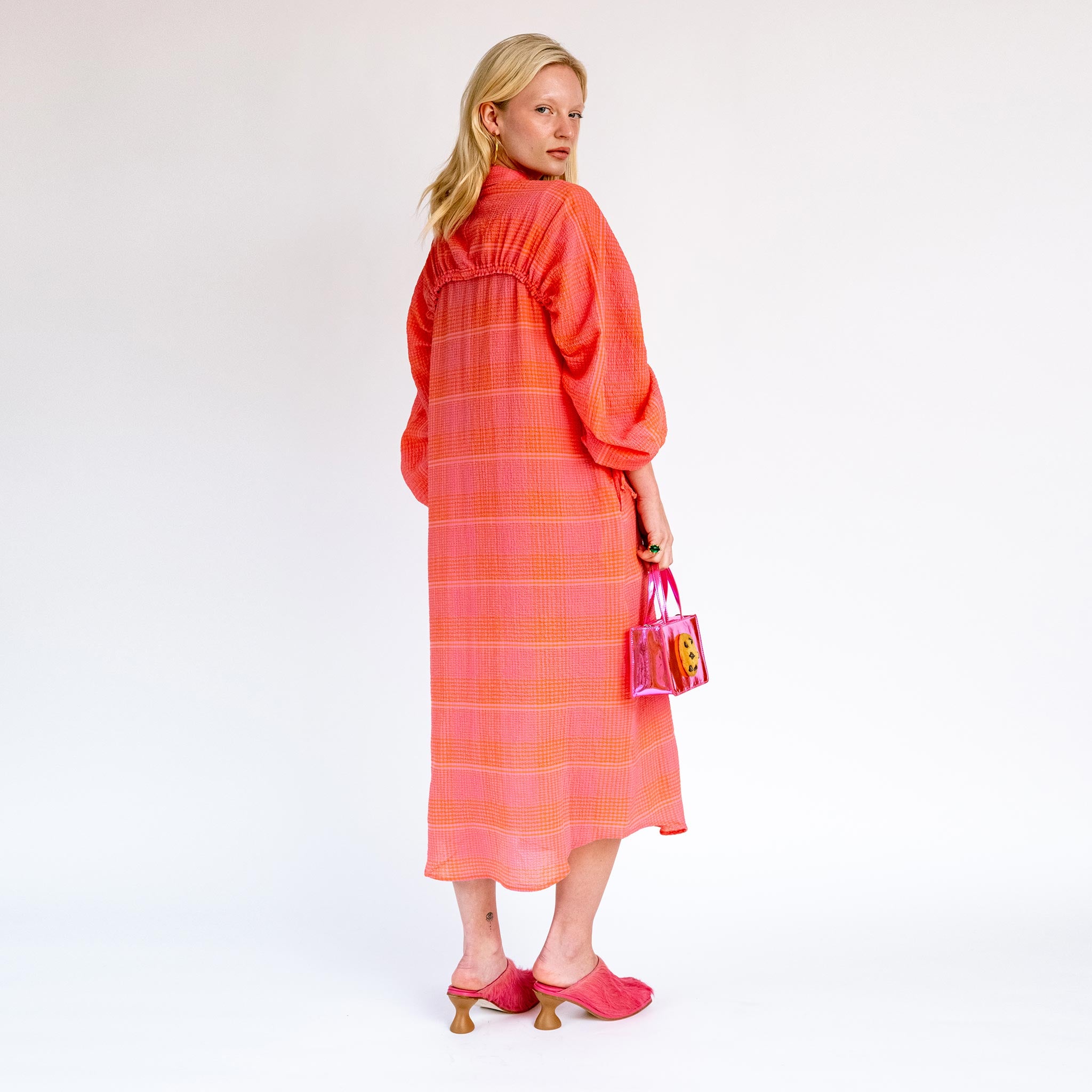 Back full body photo of model wearing the Golden Gate Dress - Pink & Orange Checks.