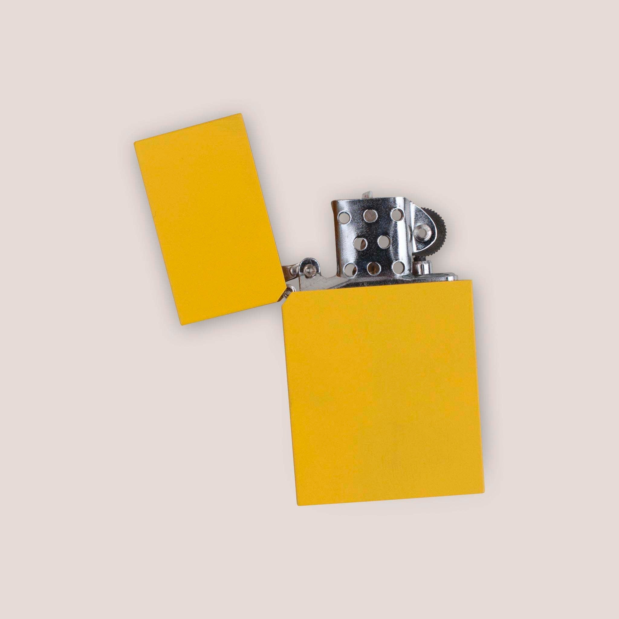 Photo of Tsubota Pearl - Hard Edge Lighter in Egg Yellow with the lid flipped open to show the lighter mechanism.