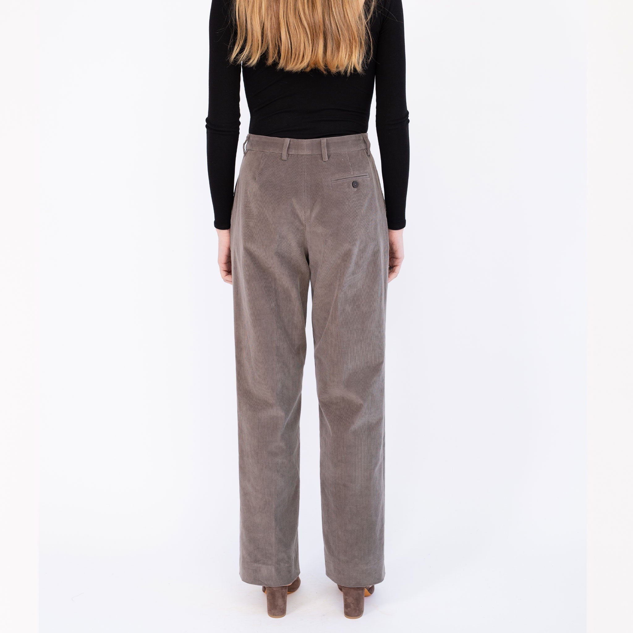 Back half body photo of model wearing the Harp Trouser - Chelsea Grey.