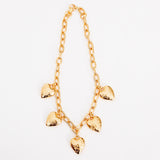 Close flat photo of model wearing the Heart Burn Necklace.