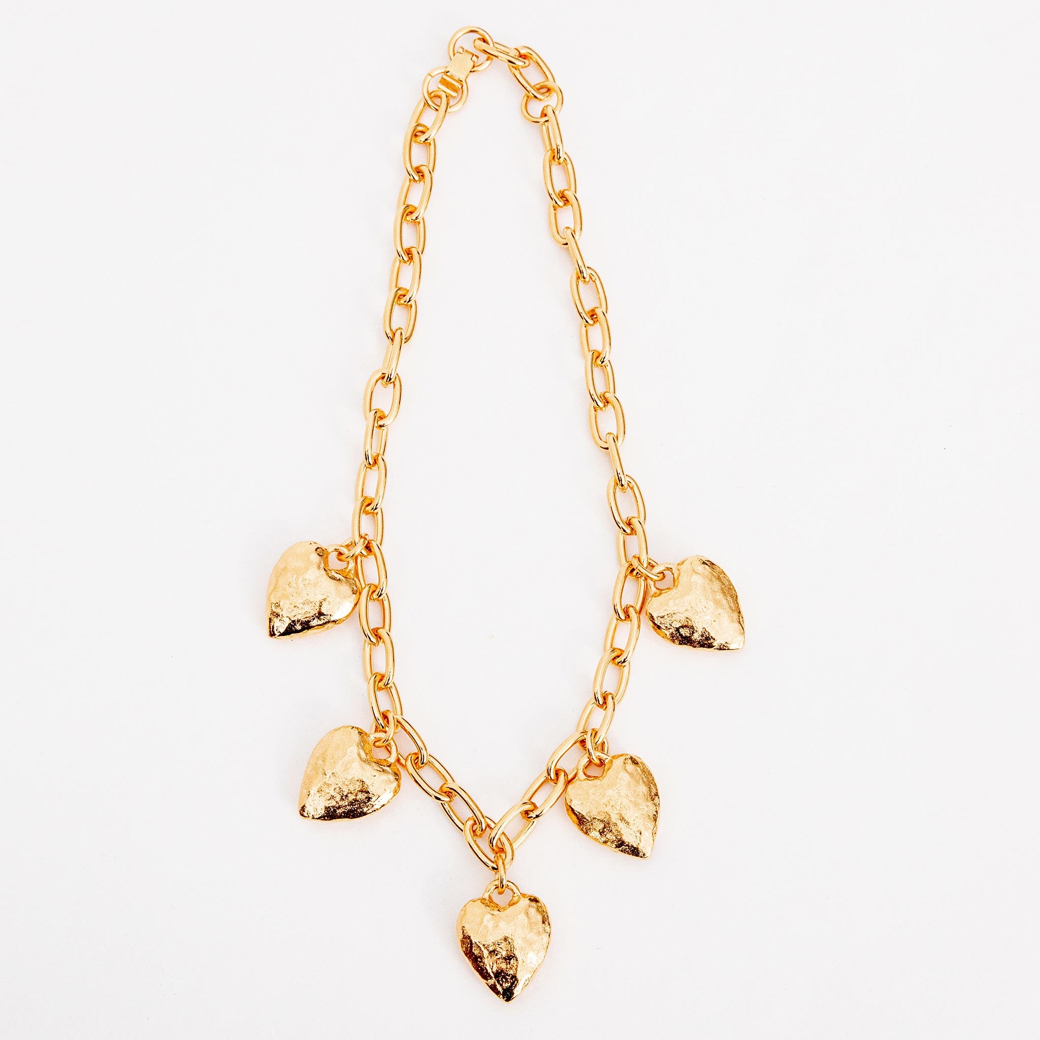 Close flat photo of model wearing the Heart Burn Necklace.