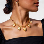 Close detail photo of model wearing the Heart Burn Necklace.