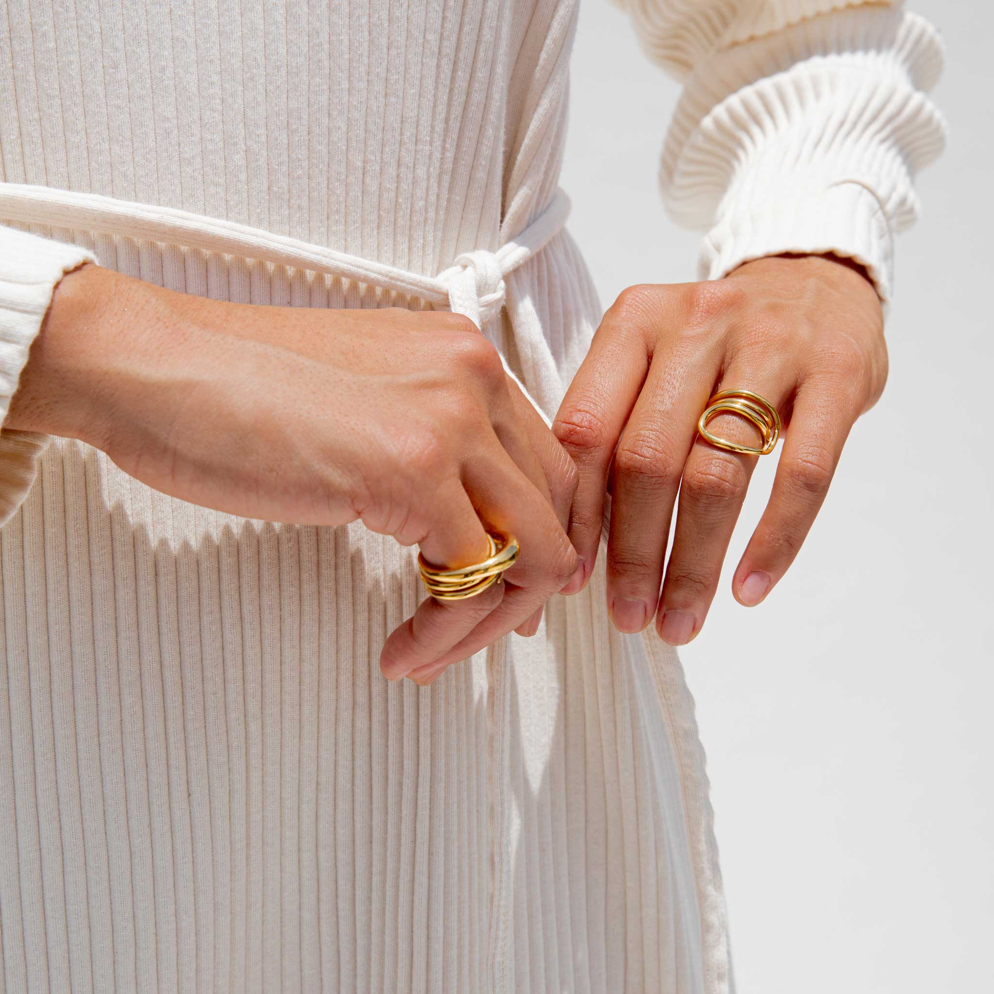 Close detailed photo of models hands wearing the hurly burly ring. 