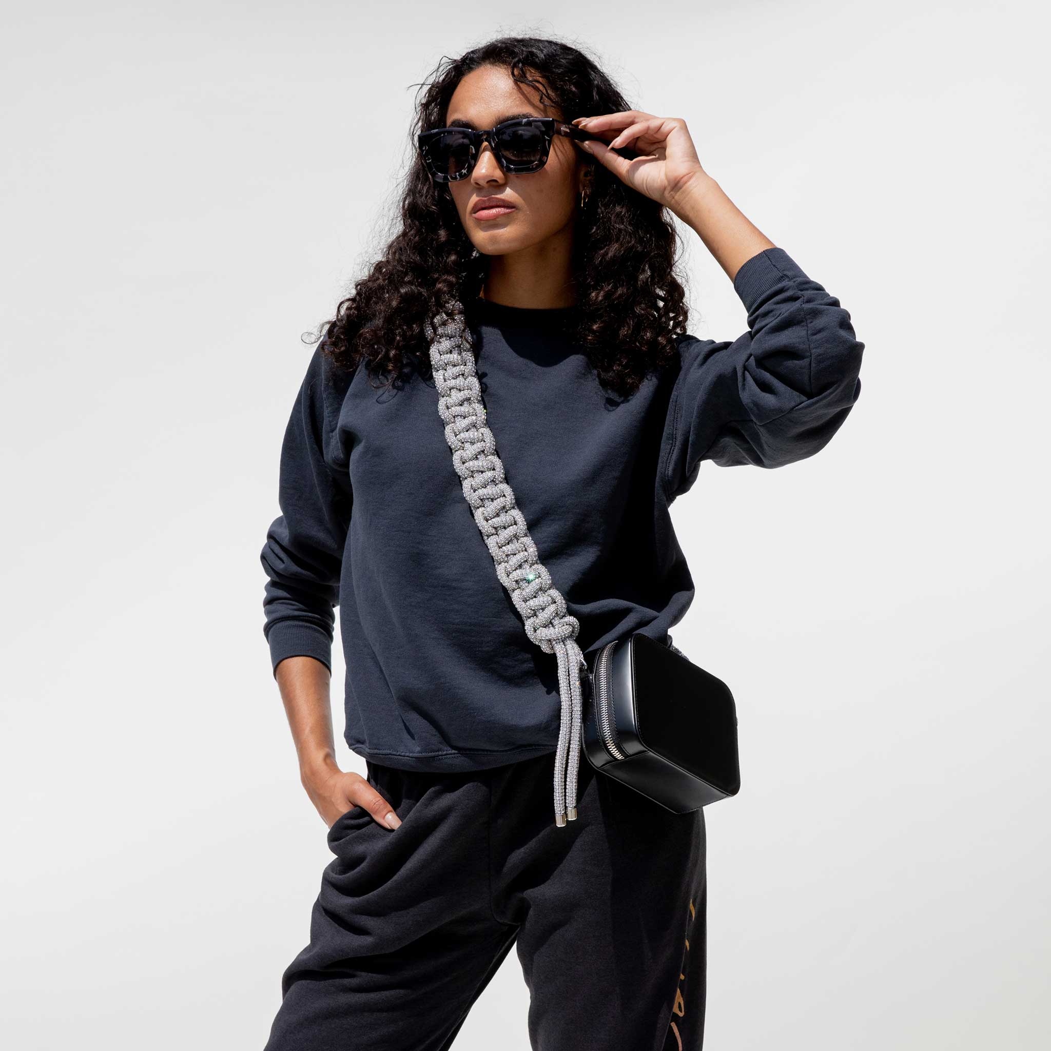 Close front detail photo of model wearing the Vintage Washed LCD10 Motto Crewneck. 
