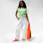 Full body photo of model wearing the Vintage Washed LCD10 Short Sleeve Motto Tee - Green. 