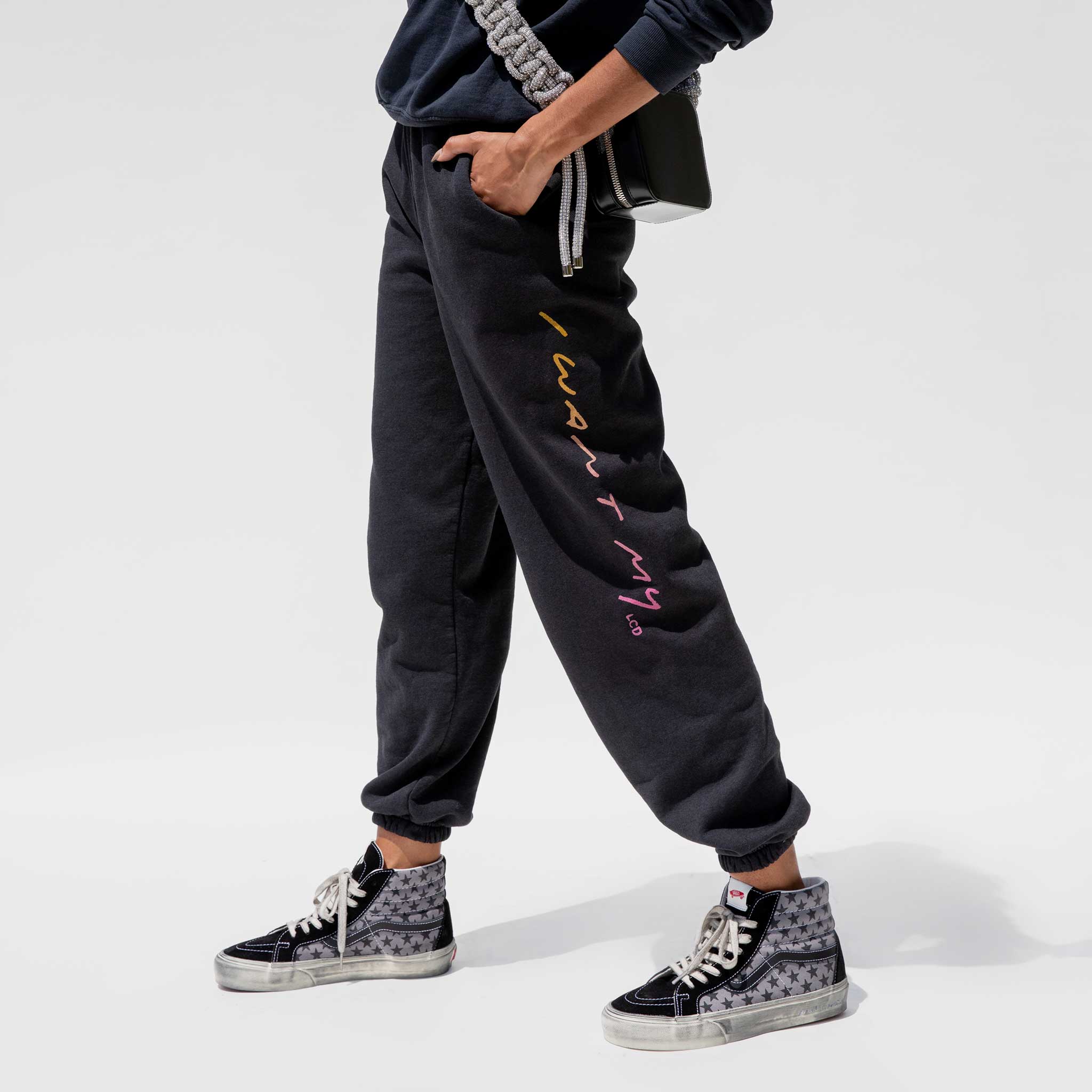 Close detail photo of model wearing the Vintage Washed LCD10 Motto Sweatpants. 