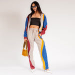 Full body photo of model wearing the Idi Track Pant - Beige.
