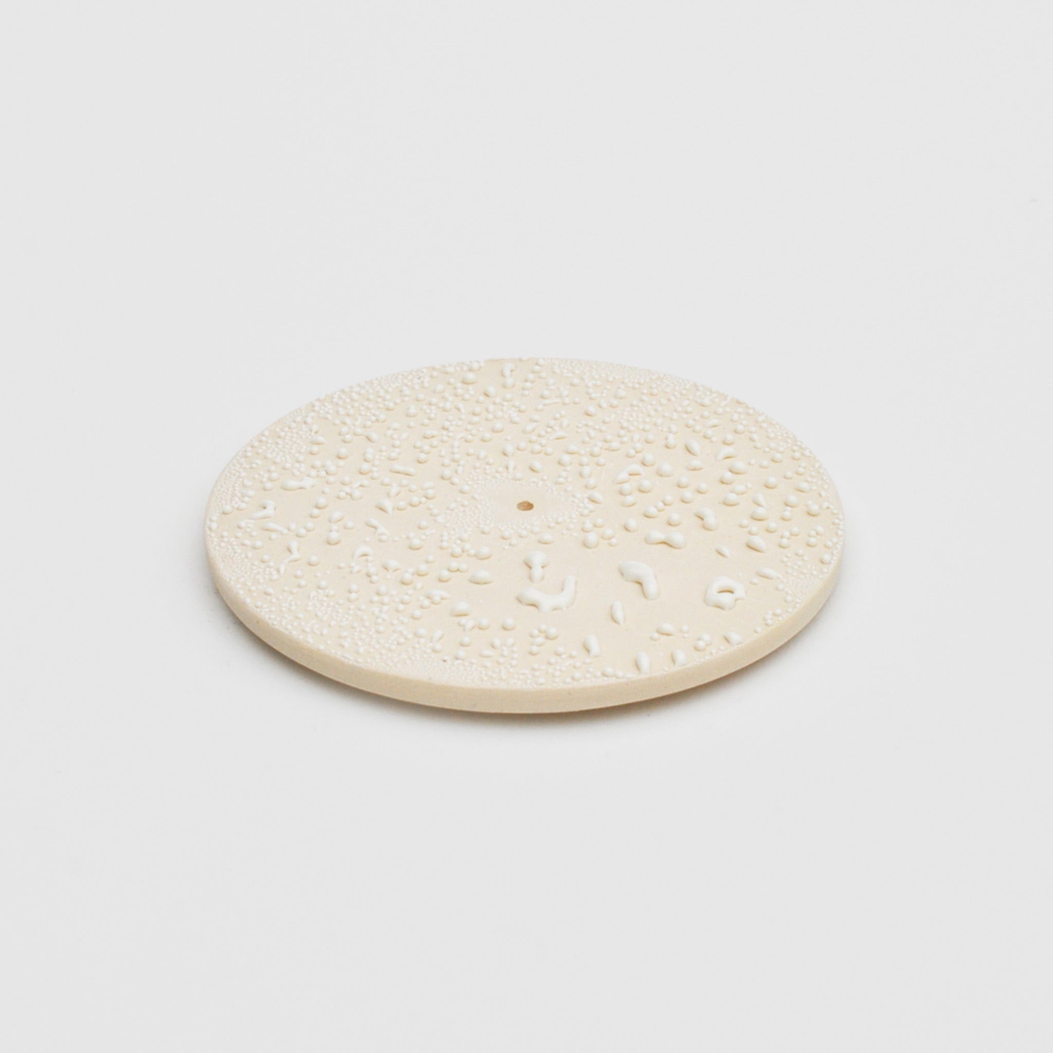 Flat image of the incense burner in white crawl by Ekua Ceramics.