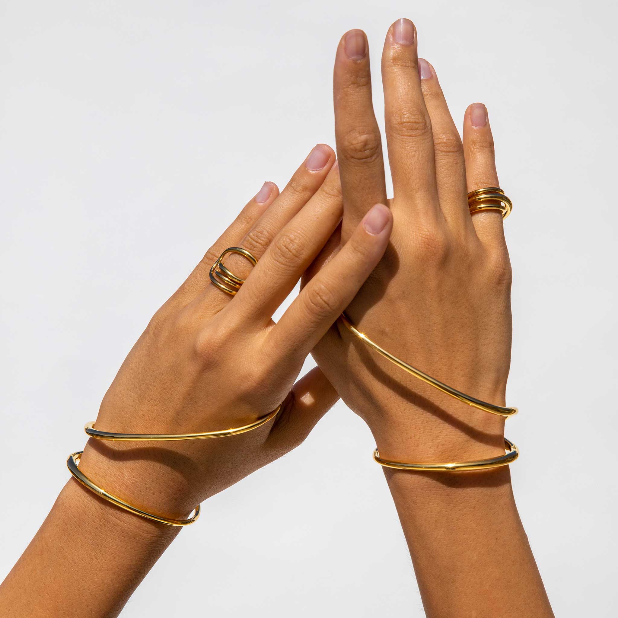 Close detail photo of two hands wearing the Ivy Bracelet 