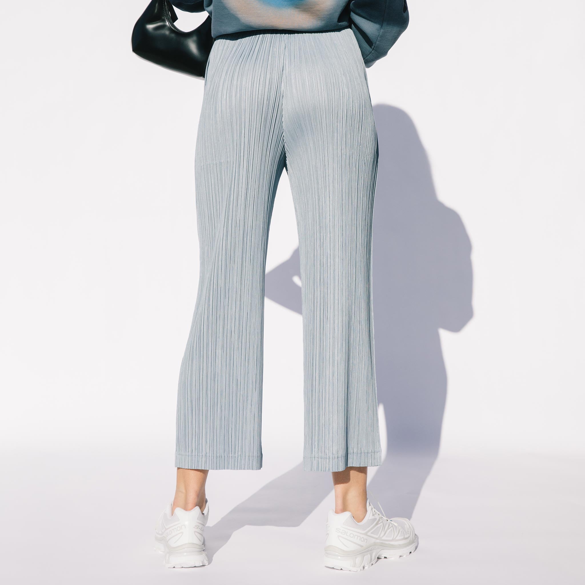 Back half body photo of model wearing the Jan Thicker Bottoms - Blue Grey. 