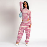 Full outfit view of the pink and white tie dyed velour Juicy Sweatpants with rhinestone embellishments.
