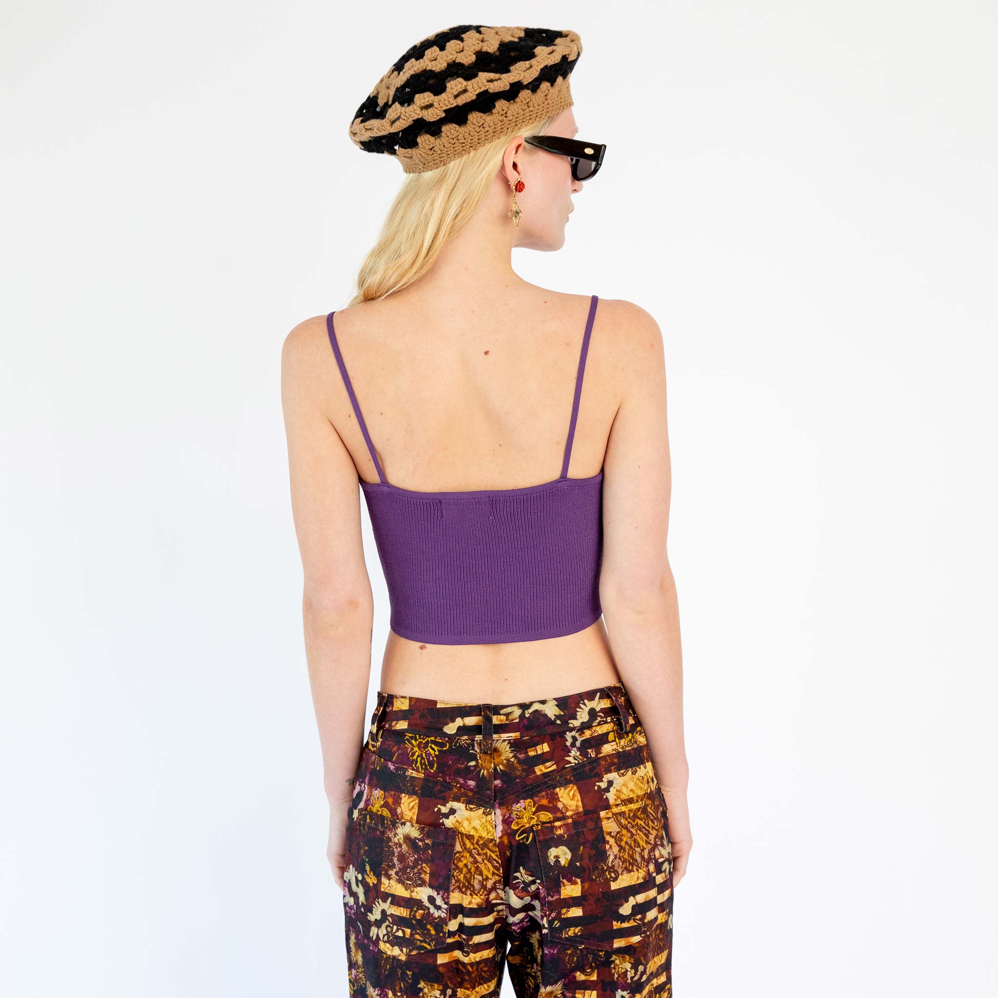Back half body photo of model wearing the Knit Bra Top - Purple.