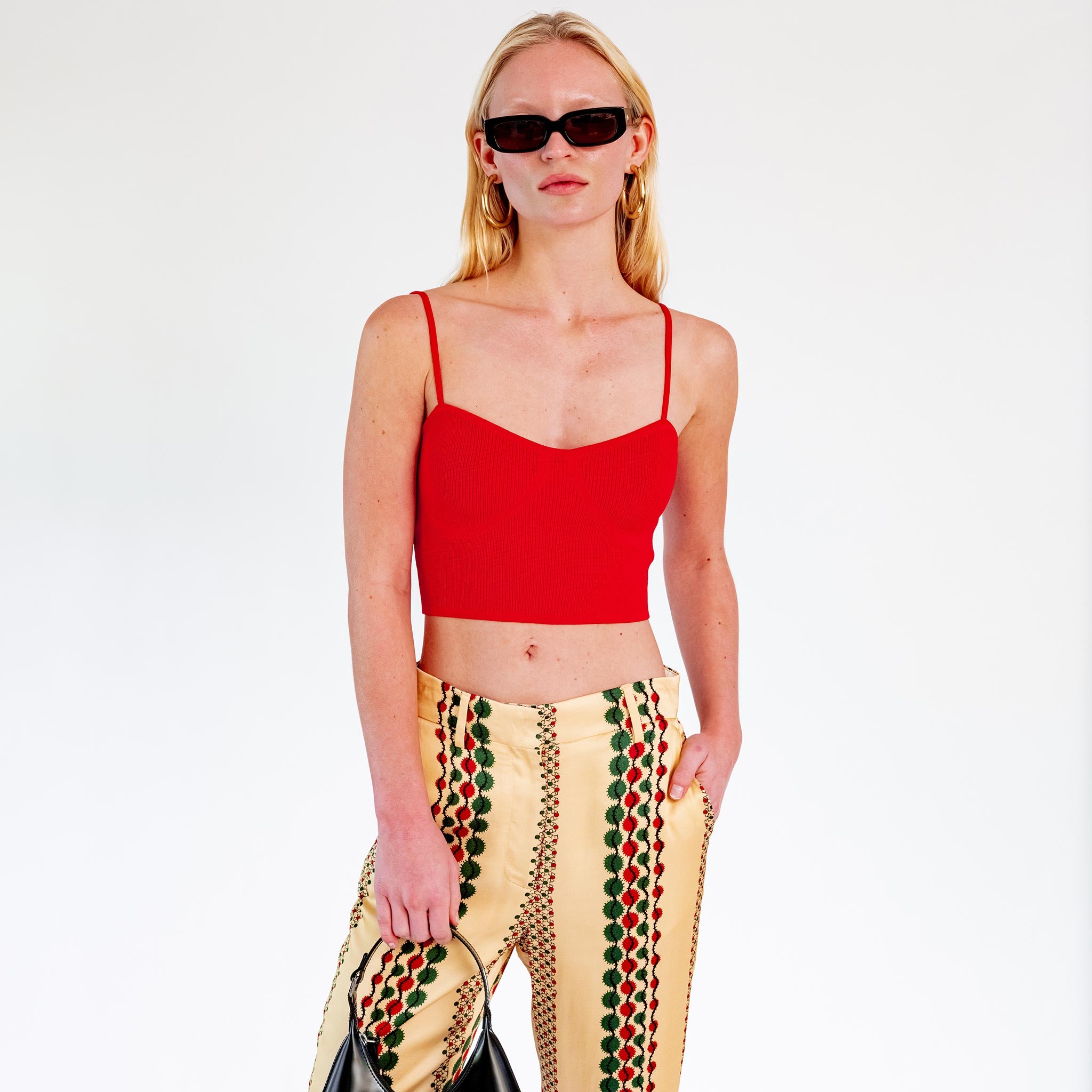 Close half body photo of model wearing the Knit Bra Top - Red.