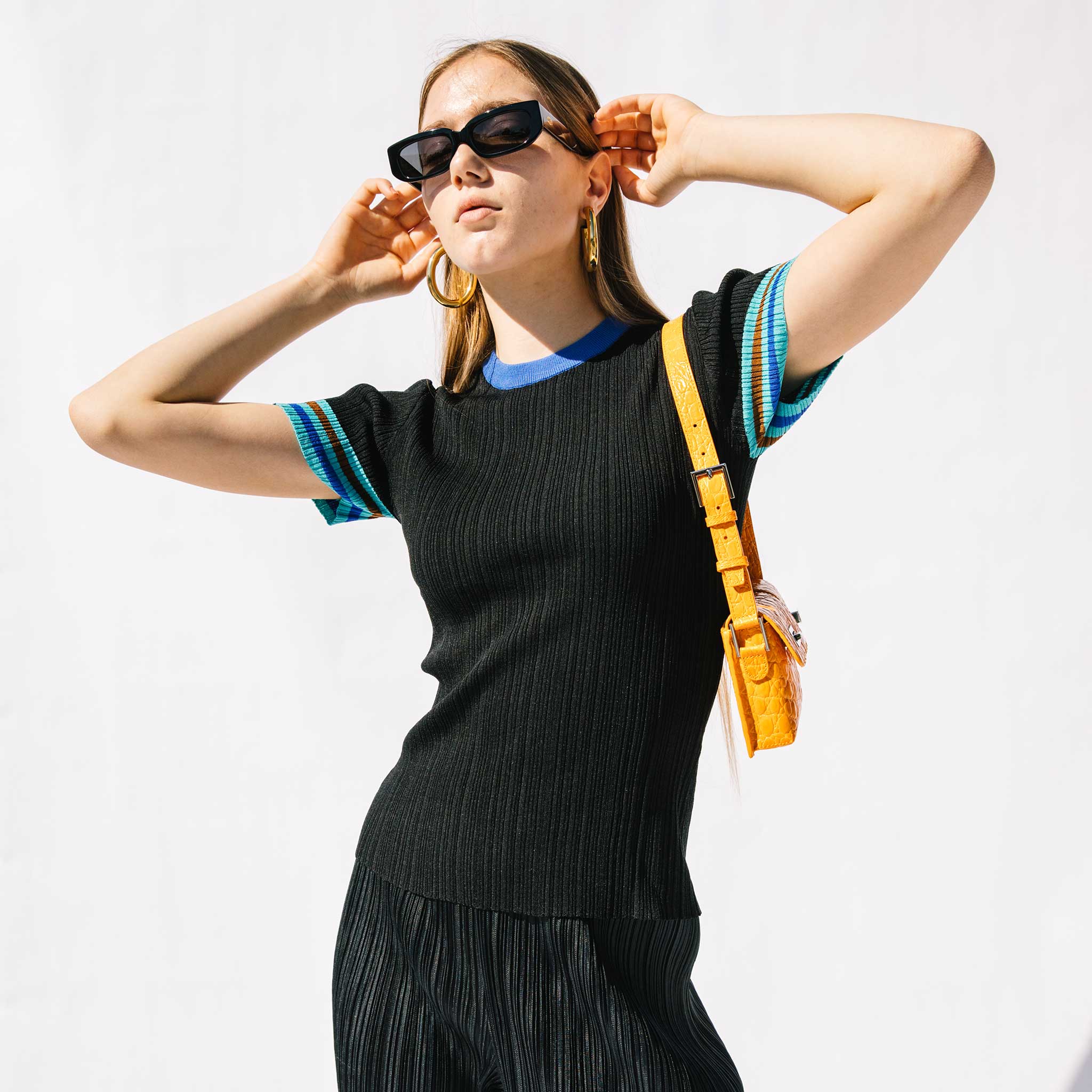 Close half body photo of model wearing the Knit Top.