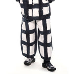 photo of model wearing the Chef Pants - Licorice Check.