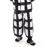 photo of model wearing the Chef Pants - Licorice Check.