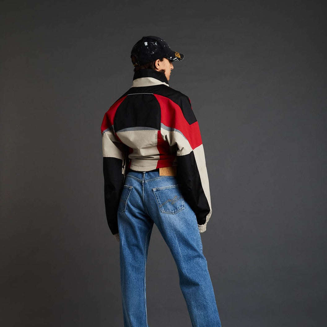 Back full body photo of model wearing the Shrunken Sports Jacket - Red/Black/Beige.