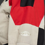 Close detail photo of model wearing the Shrunken Sports Jacket - Red/Black/Beige.