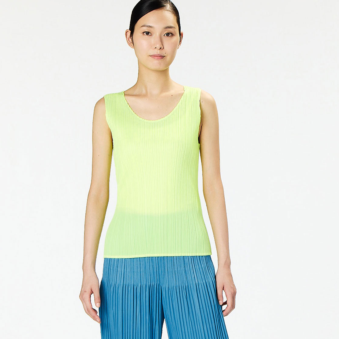 Half body photo of model wearing the Monthly Colors Shirt - Neon Yellow.