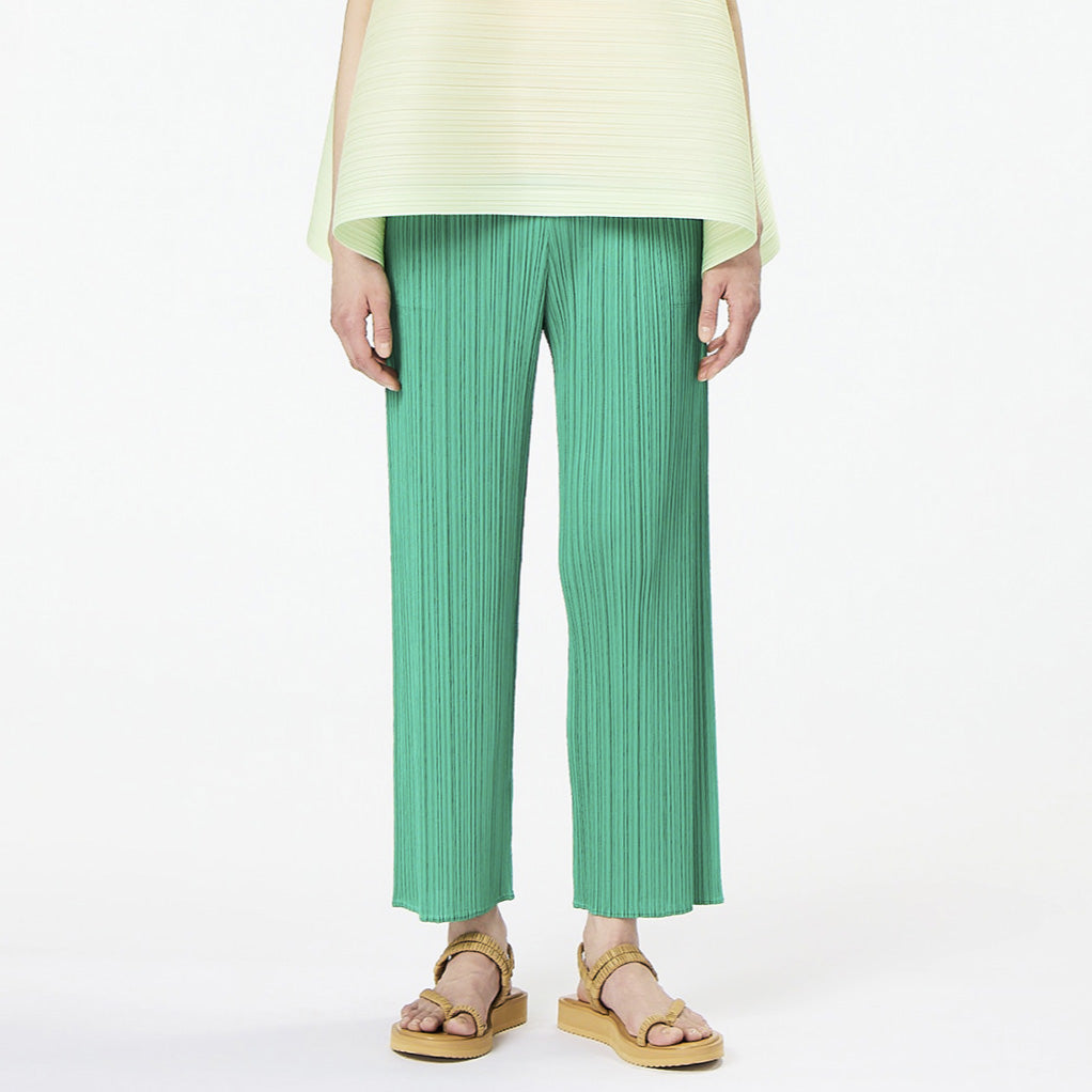 Half body photo of model wearing the May - Monthly Colors Pant - Green.