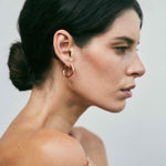 Jaclyn Moran - Mini Hoop & Post Earring in Rose Gold, pictured on model.