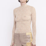 Half body photo of model wearing the Monogram Flocked Mesh Turtleneck - White/Beige.