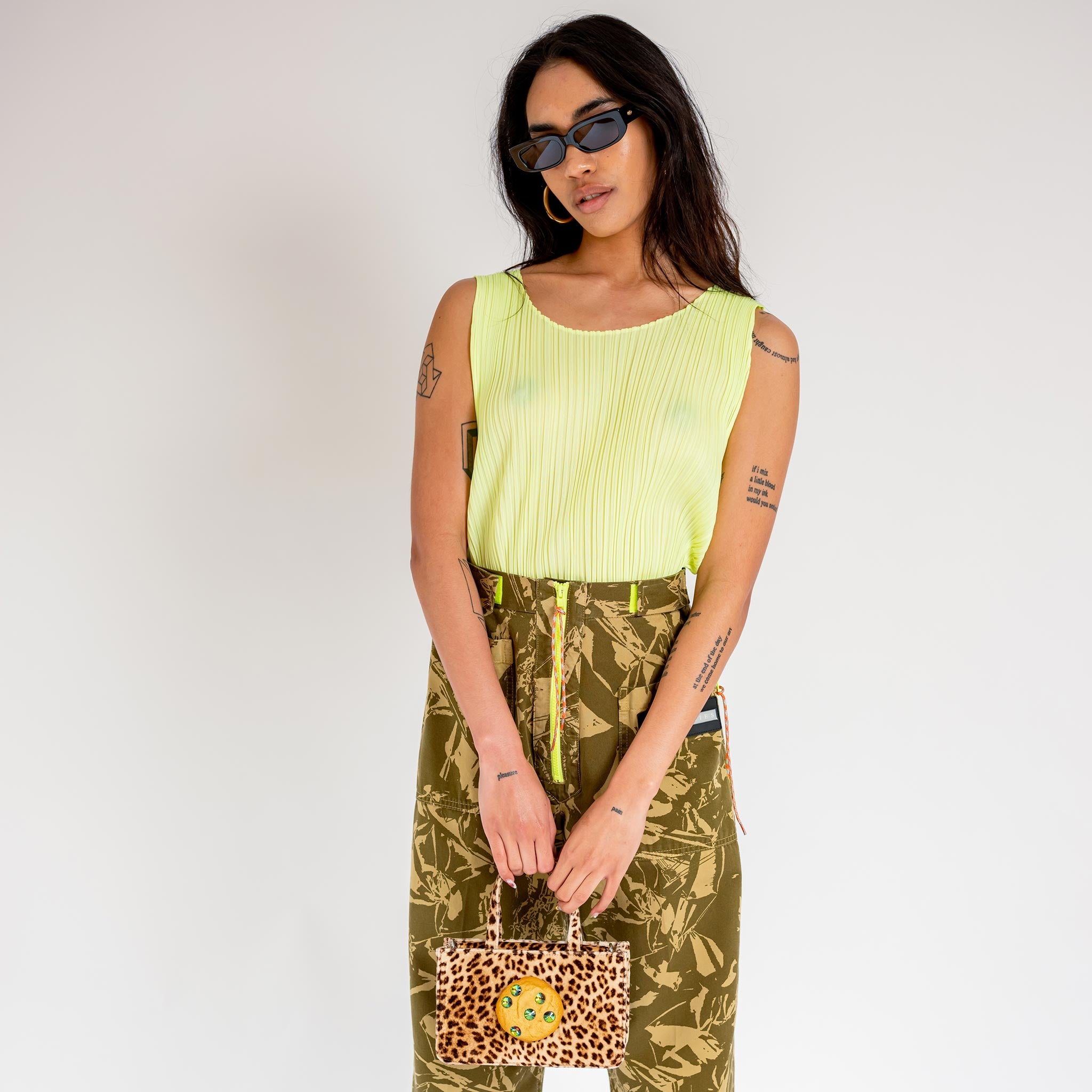 Front half body photo of model wearing the Monthly Colors Shirt - Neon Yellow.